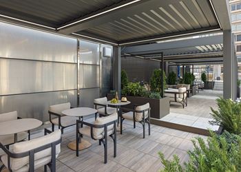 A patio with tables and chairs